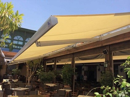 Awnings with folding arms